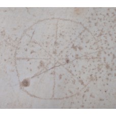 Solar cross with eight points on a marble stone